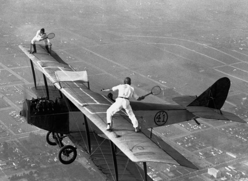 http://cdn.arkarthick.com/wp-content/uploads/2011/04/incredible-antique-OMG-photos-daredevils-tennis-biplane.jpg
