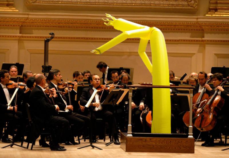 http://dudelol.com/img/wackywavinginflatablearmflailingtubeman.jpg